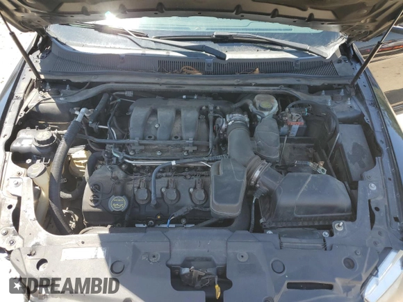 2015 Ford Taurus Limited z VIN 1FAHP2F82FG103711, wystawiony jako Copart lot #57158265 z przebiegiem 205 999 mil mil oraz Szkoda całkowita • Salvage title. Historia ofert i sprzedaży dostępna na DreamBid. Obrazek 11.