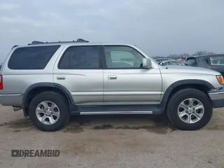 1999 Toyota 4Runner SR5 z VIN JT3GN86R1X0123115, wystawiony jako IAAI lot #41505478 z przebiegiem 173 141 mil mil oraz . Historia ofert i sprzedaży dostępna na DreamBid. Obrazek 14.