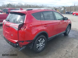 2016 Toyota RAV4 LE with VIN JTMBFREV2GJ097058, listed as a IAAI auction lot 41720372 with 118,606 mi miles. Bid and sale history available at carsss.com. Image 4.