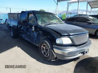 2002 Ford F-150 XL with VIN 1FTRX17WX2NB99454, listed as a IAAI auction lot 41643850 with 180,149 mi miles. Bid and sale history available at carsss.com. Image 1.