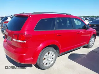2015 Dodge Journey SE z VIN 3C4PDCAB5FT679585, wystawiony jako IAAI lot #42090600 z przebiegiem 166 876 mil mil oraz . Historia ofert i sprzedaży dostępna na DreamBid. Obrazek 4.