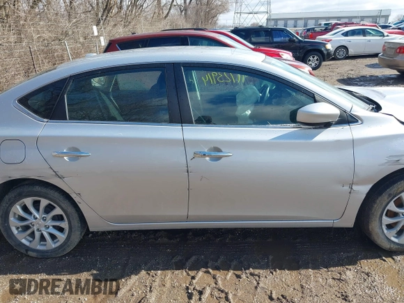 2019 Nissan Sentra S z VIN 3N1AB7APXKY372220, wystawiony jako IAAI lot #41723914 z przebiegiem 103 308 mil mil oraz . Historia ofert i sprzedaży dostępna na DreamBid. Obrazek 13.