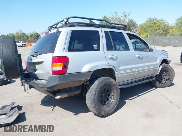 2004 Jeep Grand Cherokee Limited with VIN 1J8GW58N44C390592, listed as a IAAI auction lot 42150161 with Not provided miles and . Bid and sale history available at DreamBid. Image 4.