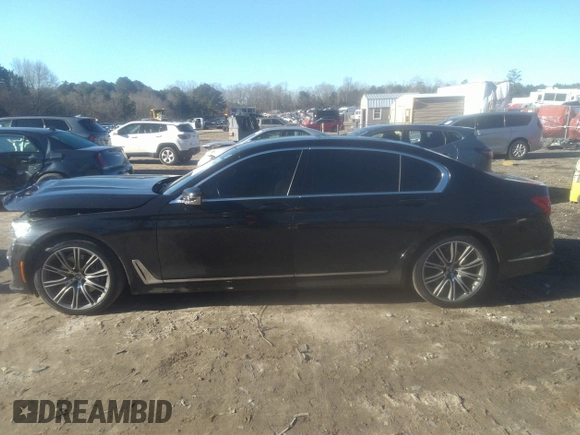 2018 BMW 7 Series 740i with VIN WBA7E2C57JG742257, listed as a IAAI auction lot 41353435 with 77,125 mi miles. Bid and sale history available at carsss.com. Image 15.