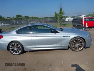 2013 BMW 6 Series 650i z VIN WBAYM9C57DDW20410, wystawiony jako IAAI lot #42348010 z przebiegiem 146 985 mil mil oraz . Historia ofert i sprzedaży dostępna na DreamBid. Obrazek 13.