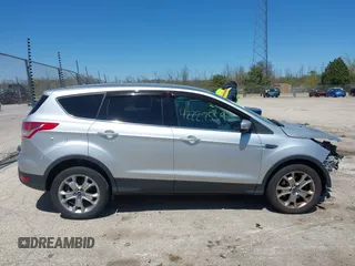 2013 Ford Escape SEL z VIN 1FMCU9H93DUA34811, wystawiony jako IAAI lot #42227559 z przebiegiem 126 495 mil mil oraz . Historia ofert i sprzedaży dostępna na DreamBid. Obrazek 14.