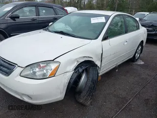 2002 Nissan Altima S with VIN 1N4AL11D72C138368, listed as a IAAI auction lot 41948552 with 242,060 mi miles. Bid and sale history available at carsss.com. Image 6.