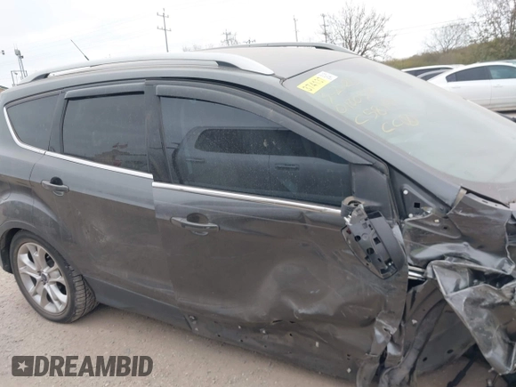 2016 Ford Escape Titanium with VIN 1FMCU0J9XGUC58149, listed as a IAAI auction lot 41739005 with 111,594 mi miles. Bid and sale history available at carsss.com. Image 12.