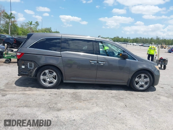 2013 Honda Odyssey Touring with VIN 5FNRL5H96DB068843, listed as a IAAI auction lot 42312176 with 115,804 mi miles and . Bid and sale history available at DreamBid. Image 14.