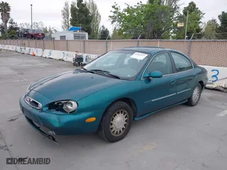 1996 Mercury Sable LS with VIN 1MELM53S0TG600877, listed as a IAAI auction lot 42063937 with 200,405 mi miles. Bid and sale history available at carsss.com. Image 6.