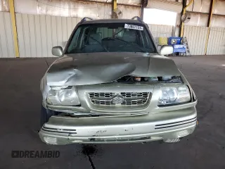 1999 Suzuki Grand Vitara LX z VIN JS3TD62V3X4123048, wystawiony jako Copart lot #73007124 z przebiegiem 159 828 mil mil oraz Szkoda całkowita • Salvage title. Historia ofert i sprzedaży dostępna na DreamBid. Obrazek 5.