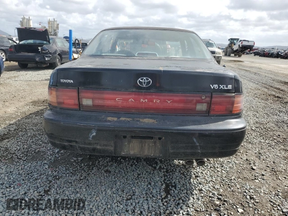 1994 Toyota Camry XLE with VIN JT2GK13E0R0012242, listed as a Copart auction lot 50966775 with 70,922 mi miles and Salvage Title. Bid and sale history available at carsss.com. Image 6.