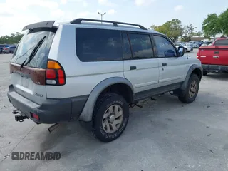 2003 Mitsubishi Montero Sport XLS with VIN JA4MT31R03J023679, listed as a IAAI auction lot 41872682 with 148,365 mi miles. Bid and sale history available at carsss.com. Image 4.
