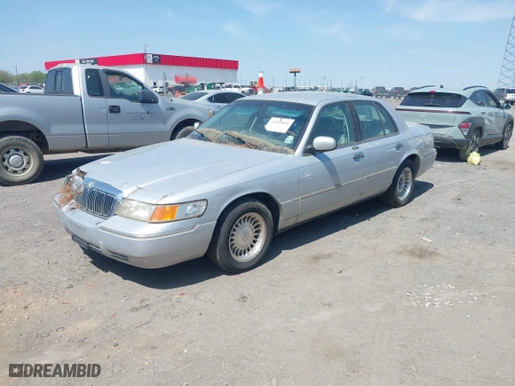 2002 Mercury Grand Marquis LS Premium with VIN 2MEFM75W02X660966, listed as a IAAI auction lot 41869806 with 133,758 mi miles. Bid and sale history available at carsss.com. Image 2.