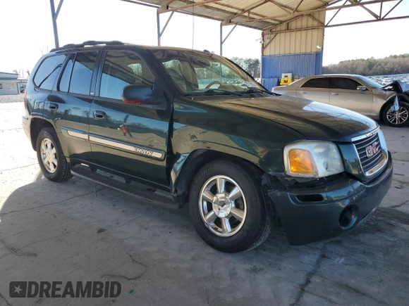 2004 GMC Envoy SLT z VIN 1GKDS13S942127830, wystawiony jako Copart lot #87165024 z przebiegiem 172 592 mil mil oraz Szkoda całkowita • Salvage title. Historia ofert i sprzedaży dostępna na DreamBid. Obrazek 4.