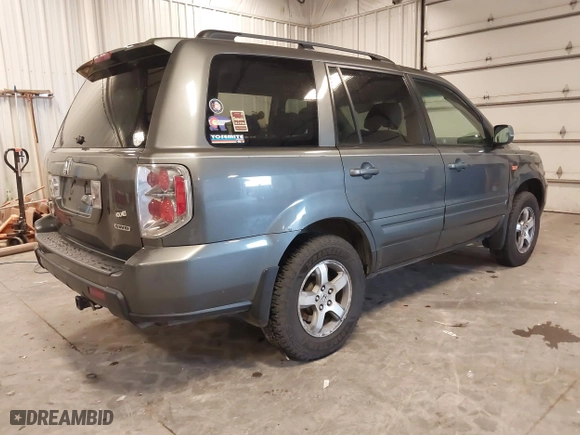 2007 Honda Pilot EX-L with VIN 2HKYF187X7H528523, listed as a IAAI auction lot 40977045 with 139,463 mi miles. Bid and sale history available at carsss.com. Image 4.