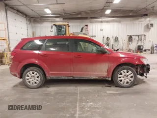 2015 Dodge Journey American Value z VIN 3C4PDCAB5FT720300, wystawiony jako IAAI lot #42074690 z przebiegiem 144 690 mil mil oraz . Historia ofert i sprzedaży dostępna na DreamBid. Obrazek 13.