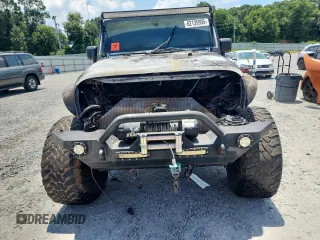 2007 Jeep Wrangler Unlimited Sahara с VIN 1J4GA59167L183198, выставлен на аукционе Copart как лот 62135995 с пробегом Не указан миль и Списание • Salvage title. История ставок и продаж доступна на DreamBid. Изображение 5.