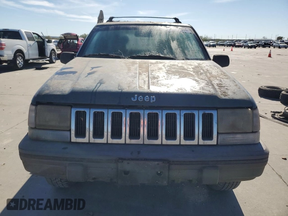 1995 Jeep Grand Cherokee Laredo with VIN 1J4FX58S5SC741328, listed as a Copart auction lot 82034594 with 260,398 mi miles and Clean Title. Bid and sale history available at carsss.com. Image 5.