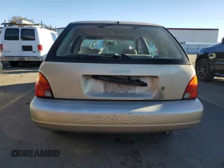 1999 Saturn SW z VIN 1G8ZK8271XZ368987, wystawiony jako Copart lot #82610964 z przebiegiem 222 100 mil mil oraz Tytuł czysty. Historia ofert i sprzedaży dostępna na DreamBid. Obrazek 6.