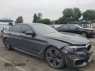 2019 BMW 5 Series M550i xDrive with VIN WBAJB9C59KB287501, listed as a Copart auction lot 59732425 with 74,345 mi miles and Salvage title. Bid and sale history available at DreamBid. Image 4.