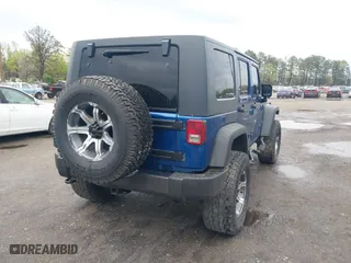 2010 Jeep Wrangler Unlimited Sport with VIN 1J4BA3H11AL144560, listed as a IAAI auction lot 42013032 with 226,233 mi miles. Bid and sale history available at carsss.com. Image 4.