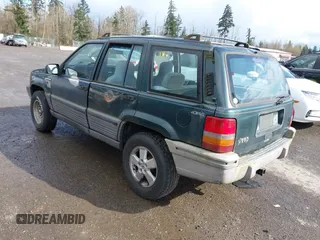 1995 Jeep Grand Cherokee Laredo with VIN 1J4GZ58SXSC676393, listed as a IAAI auction lot 41943464 with 244,317 mi miles. Bid and sale history available at carsss.com. Image 3.
