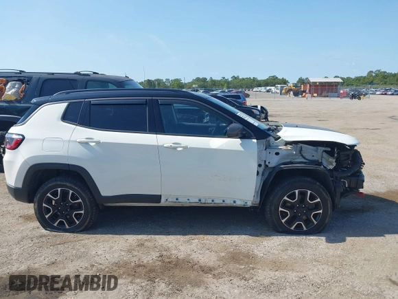 2021 Jeep Compass Trailhawk with VIN 3C4NJDDB7MT564467, listed as a IAAI auction lot 42330939 with 76,963 mi miles and . Bid and sale history available at DreamBid. Image 13.