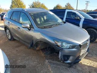 2015 Mazda CX-5 Grand Touring with VIN JM3KE2DY5F0529062, listed as a IAAI auction lot 41227421 with 123,315 mi miles. Bid and sale history available at carsss.com. Image 1.