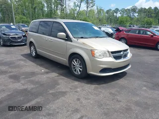 2014 Dodge Grand Caravan SXT z VIN 2C4RDGCG1ER182396, wystawiony jako IAAI lot #42148810 z przebiegiem 121 056 mil mil oraz . Historia ofert i sprzedaży dostępna na DreamBid. Obrazek 1.