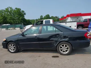2003 Toyota Camry LE z VIN 4T1BE30KX3U197331, wystawiony jako IAAI lot #42298164 z przebiegiem 248 008 mil mil oraz . Historia ofert i sprzedaży dostępna na DreamBid. Obrazek 14.