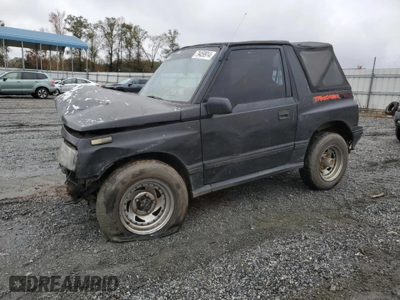 1992 Geo Tracker z VIN 2CNBJ18U8N6938728, wystawiony jako Copart lot #79459914 z przebiegiem 17 751 mil mil oraz Szkody całkowita. Historia ofert i sprzedaży dostępna na DreamBid. Obrazek 1.