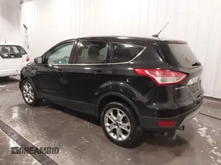 2013 Ford Escape SEL with VIN 1FMCU9H99DUD11347, listed as a IAAI auction lot 41758824 with 154,339 mi miles. Bid and sale history available at carsss.com. Image 3.