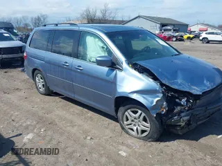 2007 Honda Odyssey EX-L with VIN 5FNRL38727B092077, listed as a IAAI auction lot 41972810 with 211,770 mi miles and . Bid and sale history available at DreamBid. Image 1.