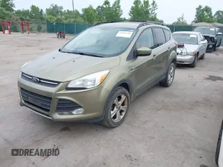 2013 Ford Escape SE with VIN 1FMCU9GX2DUC43098, listed as a IAAI auction lot 42687520 with 104,084 mi miles and . Bid and sale history available at DreamBid. Image 2.