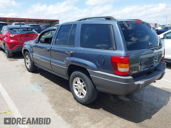 2004 Jeep Grand Cherokee Laredo with VIN 1J4GX48S44C205469, listed as a IAAI auction lot 42310571 with 154,929 mi miles and . Bid and sale history available at DreamBid. Image 3.