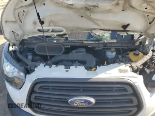 2018 Ford Transit z VIN 1FTYR1ZM3JKA37330, wystawiony jako Copart lot #72782594 z przebiegiem Nie podano mil oraz Szkoda całkowita • Salvage title. Historia ofert i sprzedaży dostępna na DreamBid. Obrazek 12.