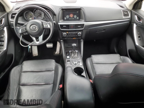 2016 Mazda CX-5 Grand Touring with VIN JM3KE4DY5G0660201, listed as a Copart auction lot 52165205 with 108,231 mi miles and Salvage Title. Bid and sale history available at DreamBid. Image 8.