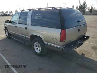 1999 GMC Suburban with VIN 3GKEC16R0XG526194, listed as a Copart auction lot 83740634 with 199,583 mi miles and Clean title. Bid and sale history available at DreamBid. Image 2.