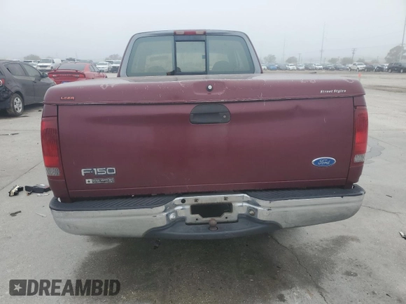1997 Ford F-150 with VIN 2FTDX1726VCA74811, listed as a Copart auction lot 81909844 with 136,520 mi miles and Salvage title. Bid and sale history available at DreamBid. Image 6.