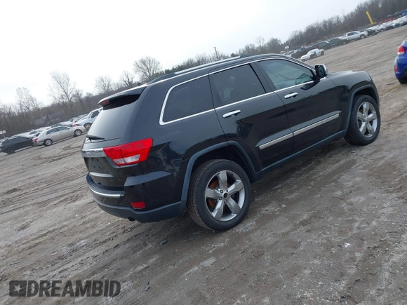2013 Jeep Grand Cherokee Overland with VIN 1C4RJECG5DC621149, listed as a IAAI auction lot 41255140 with 157,355 mi miles. Bid and sale history available at carsss.com. Image 4.