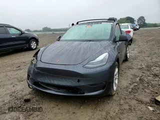 2023 Tesla Model Y Long Range z VIN 7SAYGDEE7PF870370, wystawiony jako Copart lot #55700135 z przebiegiem 32 410 mil mil oraz Szkoda całkowita • Salvage title. Historia ofert i sprzedaży dostępna na DreamBid. Obrazek 13.