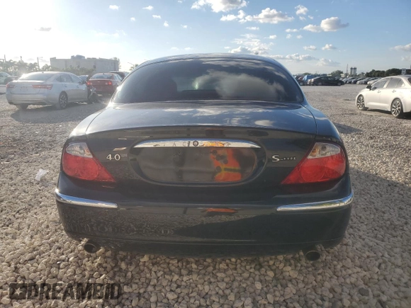 2000 Jaguar S-Type V8 z VIN SAJDA01D4YGL61655, wystawiony jako Copart lot #85873054 z przebiegiem 85 239 mil mil oraz Nie do naprawy • Non repairable. Historia ofert i sprzedaży dostępna na DreamBid. Obrazek 6.