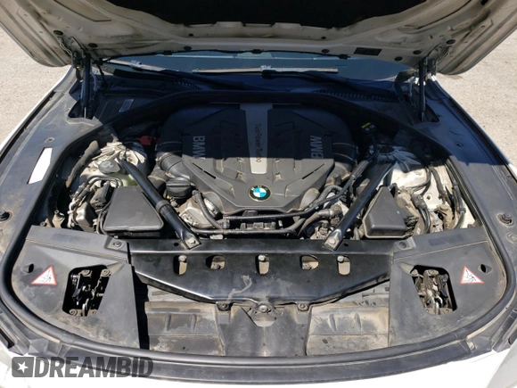 2015 BMW 7 Series 750Li z VIN WBAYE8C50FD782356, wystawiony jako Copart lot #64578895 z przebiegiem 195 656 mil mil oraz Czysty tytuł • Clean title. Historia ofert i sprzedaży dostępna na DreamBid. Obrazek 11.