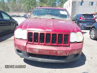 2009 Jeep Grand Cherokee Laredo with VIN 1J8GR48K79C543304, listed as a IAAI auction lot 42151011 with 157,679 mi miles. Bid and sale history available at carsss.com. Image 6.