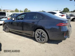 2024 BMW i5 eDrive40 with VIN WBY33FK03RCS14771, listed as a Copart auction lot 62393255 with 25,192 mi miles and Salvage title. Bid and sale history available at DreamBid. Image 2.