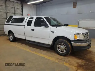 2001 Ford F-150 XL with VIN 1FTRX17L51NB25752, listed as a Copart auction lot 48721235 with 179,941 mi miles and Salvage title. Bid and sale history available at DreamBid. Image 4.