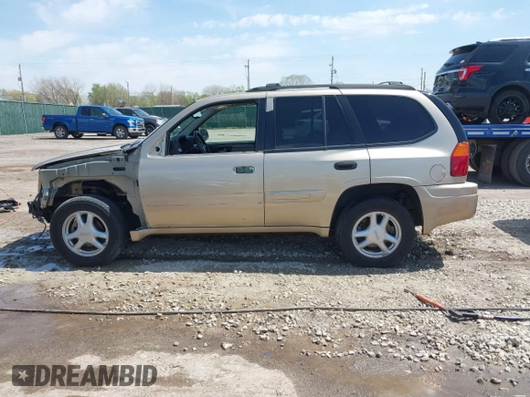 2005 GMC Envoy SLE with VIN 1GKDT13S252264932, listed as a IAAI auction lot 41981566 with 140,566 mi miles. Bid and sale history available at carsss.com. Image 15.