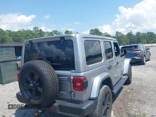 2021 Jeep Wrangler Unlimited Sahara with VIN 1C4HJXEN3MW628845, listed as a IAAI auction lot 42438049 with 49,970 mi miles and . Bid and sale history available at DreamBid. Image 4.