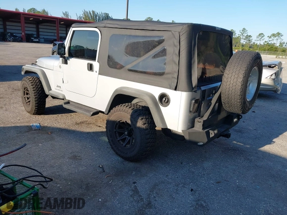 2005 Jeep Wrangler Unlimited with VIN 1J4FA44S65P335444, listed as a IAAI auction lot 41731093 with 143,918 mi miles. Bid and sale history available at carsss.com. Image 3.